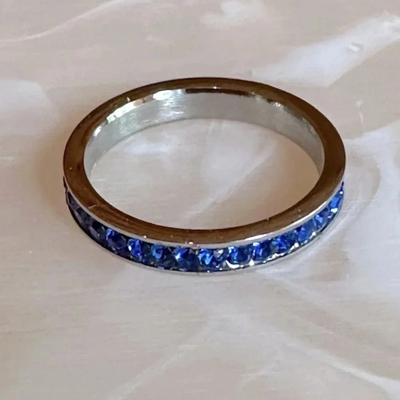 Boutique Jewelry - Blue Sapphire Colored CZ Stainless Steel Eternity Band Ring September Birthstone